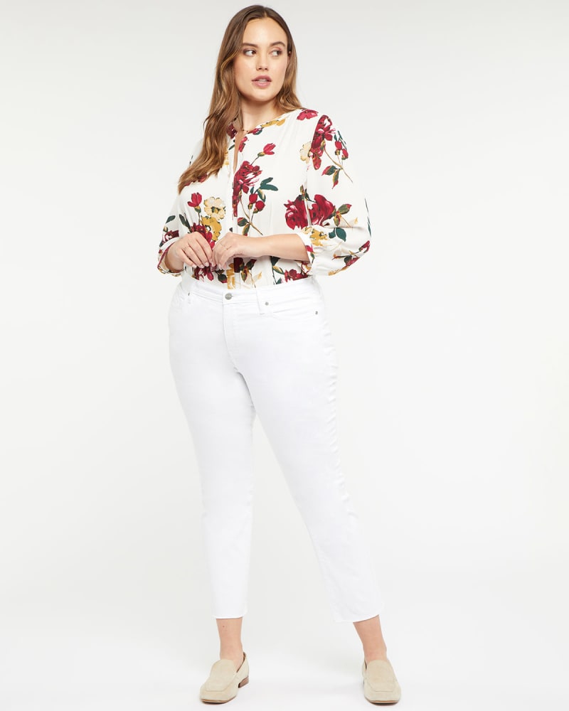 Front of a model wearing a size 14 Sheri Ankle Fray Jeans in Optic White by NYDJ. | dia_product_style_image_id:296177